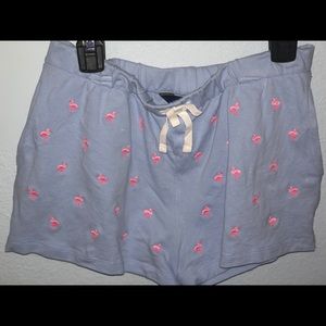 Blue shorts with flamingos on them
